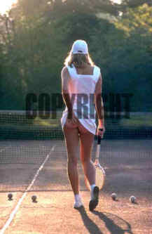 Tennis girl scratching arse